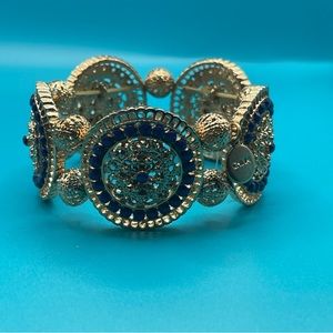 Gold beaded bracelet with dark blue detailing